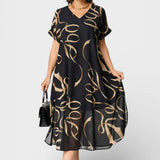 Emma™ | Vestido elegante negro y dorado