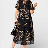 Emma™ | Vestido elegante negro y dorado
