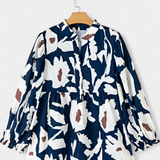 Blusa Filomena con Media Abotonadura y Mangas Abullonadas en Estampado Floral Abstracto